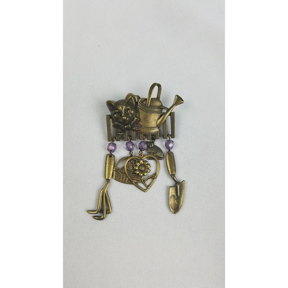 Vintage JJ brooch pin gold tone cat head on fence gardening tools